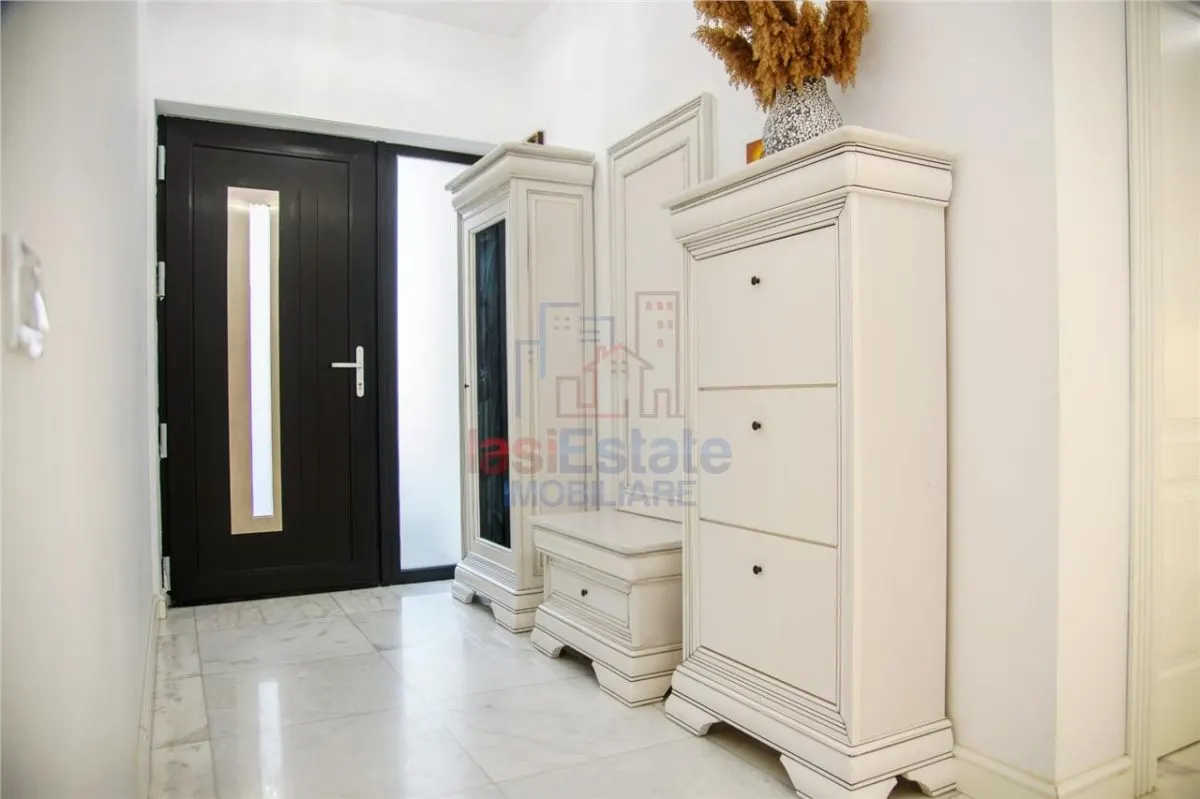Casa intr-o zona linistita cu garaj si teren-1091 mp - foto 16