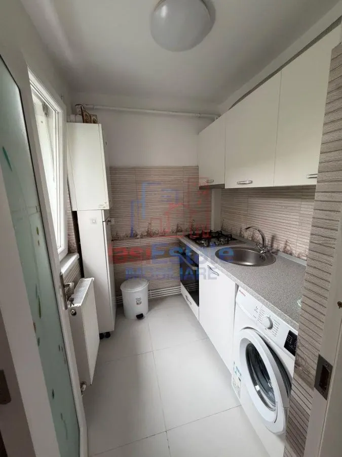 Apartament cu 2 camere de vânzare în Tătărași - etaj 1, centrală proprie, mobilat și utilat - foto 6